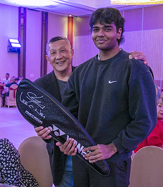 Successful auction bidder of the badminton racket donated by Dato’ Lee Chong Wei.