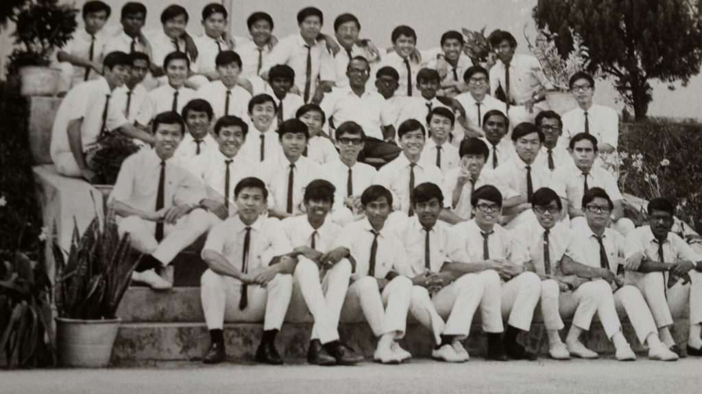 The Class of Form Five Arts One with teacher Kenneth Kulasingham, centre in the second row from the back.